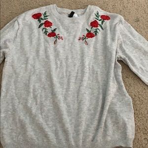 grey sweater with roses